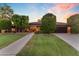 Charming single-story home with mature landscaping and a large front lawn at 8604 S Oak St, Tempe, AZ 85284