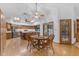 Eat-in kitchen featuring hardwood floors, wooden cabinetry, stainless steel appliances, and a breakfast table at 8604 S Oak St, Tempe, AZ 85284