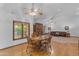 Living room with a fireplace, dining area, hardwood floors, and natural light at 8604 S Oak St, Tempe, AZ 85284