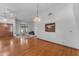 Spacious living room with hardwood floors, a large window, and elegant lighting, creating a welcoming atmosphere at 8604 S Oak St, Tempe, AZ 85284