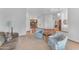 Open-concept living room featuring hardwood floors, ample natural light, and a cozy seating area, ideal for relaxation and gatherings at 8604 S Oak St, Tempe, AZ 85284