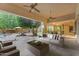 Inviting covered patio featuring cozy seating and an outdoor lounge area near the pool at 8604 S Oak St, Tempe, AZ 85284