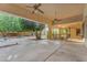 Inviting covered patio with ceiling fans, stamped concrete flooring, and views of the backyard landscaping at 8604 S Oak St, Tempe, AZ 85284