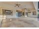 Large covered patio with ceiling fans, concrete flooring, and access to the backyard and kitchen at 8604 S Oak St, Tempe, AZ 85284