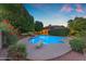 Inviting backyard pool area featuring a diving board, surrounded by vibrant landscaping and a sense of tranquility at 8604 S Oak St, Tempe, AZ 85284
