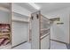 Spacious walk-in closet with shelving for ample storage and tiled floors at 8604 S Oak St, Tempe, AZ 85284