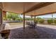 Inviting covered back patio with brick pavers and a view of the low-maintenance gravel backyard at 8620 E Sells Dr, Scottsdale, AZ 85251