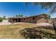 Spacious backyard with covered patio, perfect for outdoor entertaining, on a sunny day at 8620 E Sells Dr, Scottsdale, AZ 85251