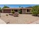 Well-kept single-story home with low-maintenance desert landscaping and a brick driveway at 8620 E Sells Dr, Scottsdale, AZ 85251