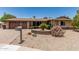 Charming single-story home with a well-maintained xeriscaped front yard and brick accents at 8620 E Sells Dr, Scottsdale, AZ 85251