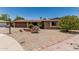 Single-story home with desert-style landscaping, gravel yard, and a brick-accented mailbox at 8620 E Sells Dr, Scottsdale, AZ 85251