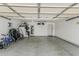 Spacious garage with epoxy floors perfect for parking and storage of your outdoor equipment at 8620 E Sells Dr, Scottsdale, AZ 85251