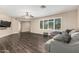 Comfortable living room featuring hardwood flooring, neutral tones, and ample natural light at 8620 E Sells Dr, Scottsdale, AZ 85251