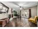 Spacious living room with a fireplace, hardwood floors, and backyard access at 8620 E Sells Dr, Scottsdale, AZ 85251
