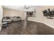 Open-concept living room showcasing hardwood floors and seamless flow into the kitchen at 8620 E Sells Dr, Scottsdale, AZ 85251