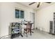 Bright home office with lots of natural light, a modern adjustable desk and ceiling fan at 8620 E Sells Dr, Scottsdale, AZ 85251
