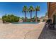 Private pool area with palm trees and a spacious patio, ideal for relaxation and outdoor fun at 8620 E Sells Dr, Scottsdale, AZ 85251