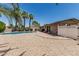 Inviting pool surrounded by palm trees and low-maintenance gravel landscaping at 8620 E Sells Dr, Scottsdale, AZ 85251