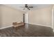 Neutral room with wood floors and a ceiling fan, awaits your personal touch to make it your own at 8620 E Sells Dr, Scottsdale, AZ 85251
