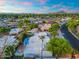 Aerial view of a home with lush landscaping, a pool, and a great neighborhood at 908 W Pershing Ave, Phoenix, AZ 85029