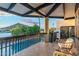 Inviting balcony with pool view, stylish wicker furniture, and picturesque mountain scenery at 908 W Pershing Ave, Phoenix, AZ 85029