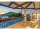 Charming balcony with mountain views, tiled floor, and stylish wicker seating at 908 W Pershing Ave, Phoenix, AZ 85029