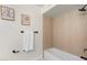 Bathroom with modern fixtures including wood paneled shower walls, and a framed floral print at 908 W Pershing Ave, Phoenix, AZ 85029