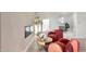 Stylish seating area, fireplace, and view into bright bathroom from primary bedroom at 908 W Pershing Ave, Phoenix, AZ 85029