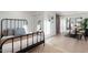 Bedroom with a modern bed frame, a mirror closet, and a view to the seating area at 908 W Pershing Ave, Phoenix, AZ 85029