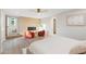 Spacious primary bedroom features a stylish accent wall, fireplace, light hardwood floors, and recessed lighting at 908 W Pershing Ave, Phoenix, AZ 85029