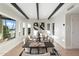 Open dining room with bright light, dark wood ceiling beams, and stylish contemporary decor at 908 W Pershing Ave, Phoenix, AZ 85029