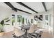 Elegant dining room featuring striking black beams, mountain views, and contemporary decor at 908 W Pershing Ave, Phoenix, AZ 85029