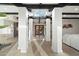 Bright entryway with chandelier, white columns, beamed ceiling and glass-paneled front door at 908 W Pershing Ave, Phoenix, AZ 85029