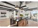 Kitchen with island and adjacent dining area in a bright, open-concept floor plan at 908 W Pershing Ave, Phoenix, AZ 85029