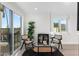 Well-lit living room featuring a modern furniture set and sliding glass doors at 908 W Pershing Ave, Phoenix, AZ 85029