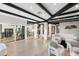 Bright and open living space showcasing wood floors, beamed ceilings, and ample natural light at 908 W Pershing Ave, Phoenix, AZ 85029