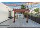 Spacious outdoor patio with a pergola and built-in grill, perfect for entertaining guests at 908 W Pershing Ave, Phoenix, AZ 85029
