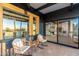 Cozy patio seating with dining and living room views through large windows at 908 W Pershing Ave, Phoenix, AZ 85029