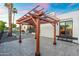 Backyard patio with large pergola, seamlessly connecting indoor and outdoor living spaces at 908 W Pershing Ave, Phoenix, AZ 85029