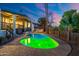 Inviting backyard pool with custom lighting and a built-in outdoor kitchen, perfect for entertaining guests at 908 W Pershing Ave, Phoenix, AZ 85029