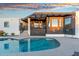 Inviting backyard pool with covered patio and well-maintained landscaping offers a relaxing outdoor oasis at 908 W Pershing Ave, Phoenix, AZ 85029