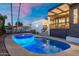 Beautiful pool with palm trees and a covered patio area, perfect for relaxation at 908 W Pershing Ave, Phoenix, AZ 85029