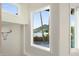 Bright view from windows showing exterior, trees, blue skies, and neighborhood at 908 W Pershing Ave, Phoenix, AZ 85029