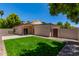 View of the private backyard with lush lawn and patio, perfect for outdoor entertaining and relaxation at 967 E Hearne Way, Gilbert, AZ 85234