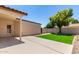 Lush backyard with well-maintained lawn and patio, offering a private and serene outdoor space at 967 E Hearne Way, Gilbert, AZ 85234