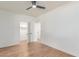The additional bedroom has wood floors, a ceiling fan, and closet access, adaptable to your lifestyle at 967 E Hearne Way, Gilbert, AZ 85234
