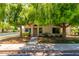 Inviting single-story home boasts mature trees, a tidy landscaped yard, and a paved walkway to the front door at 967 E Hearne Way, Gilbert, AZ 85234