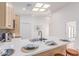 Bright kitchen features a skylight, sleek countertops, and modern finishes, ready for culinary creations at 967 E Hearne Way, Gilbert, AZ 85234
