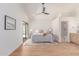 Spacious bedroom boasts natural light, wood floors, and ensuite bathroom access for a relaxing retreat at 967 E Hearne Way, Gilbert, AZ 85234
