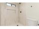 Newly tiled shower with rainfall shower head and window provides a spa-like experience at 967 E Hearne Way, Gilbert, AZ 85234